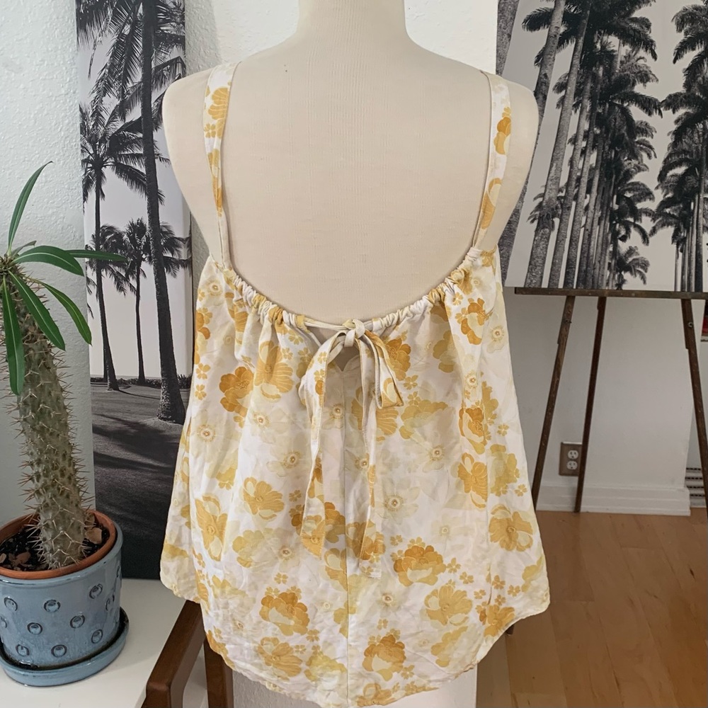 Rhythm mellow yellow floral top with adjustable shoulder straps via back tie.